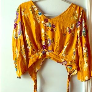 Yellow tie in the back flow top